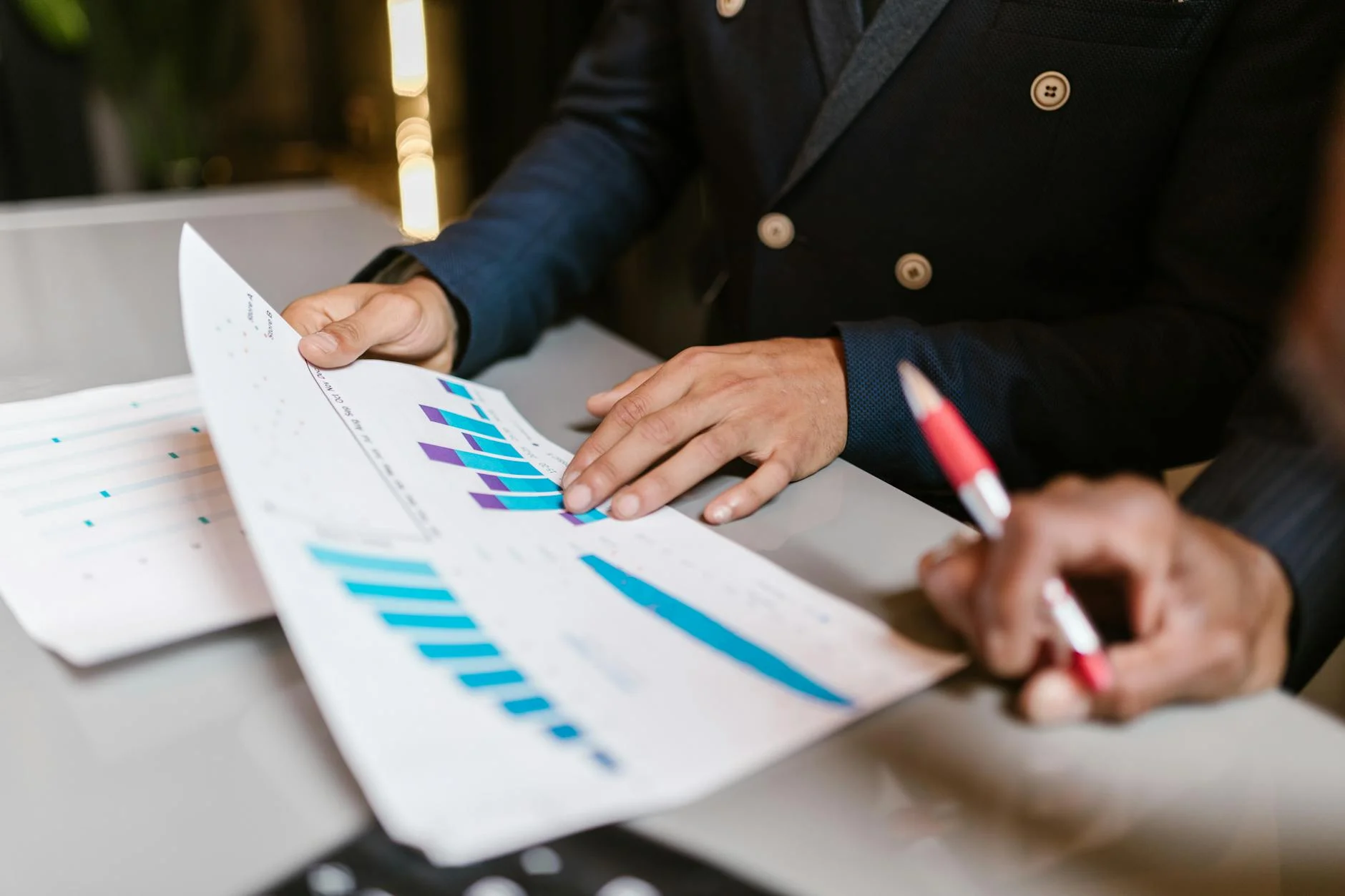 Operations team reviewing a business software dashboard on a large monitor