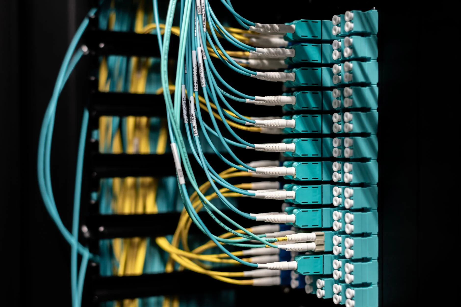 Server rack with neatly organized cables in a data center hallway