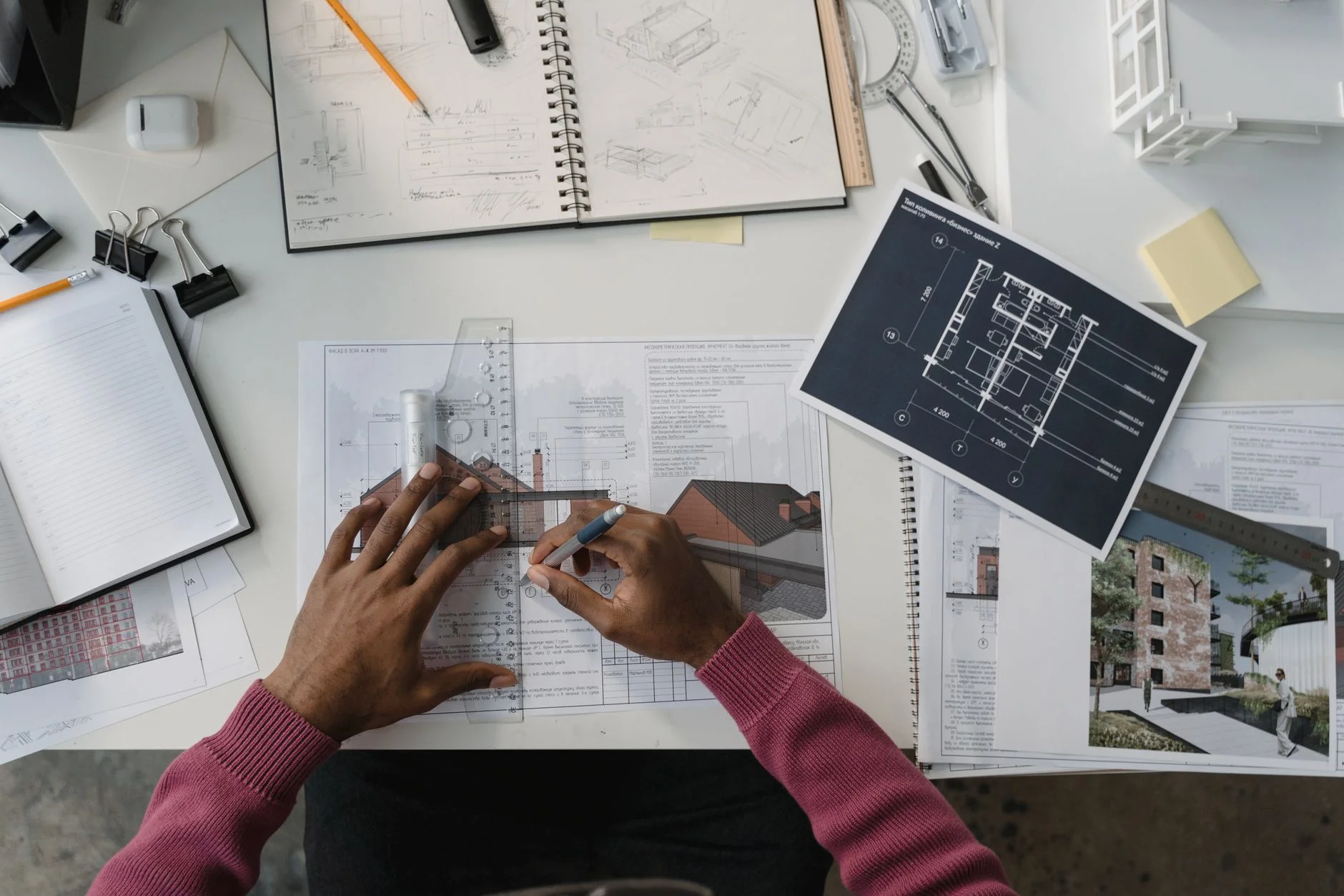 An architectural blueprint with a pencil and ruler laid across it, representing planning a business process