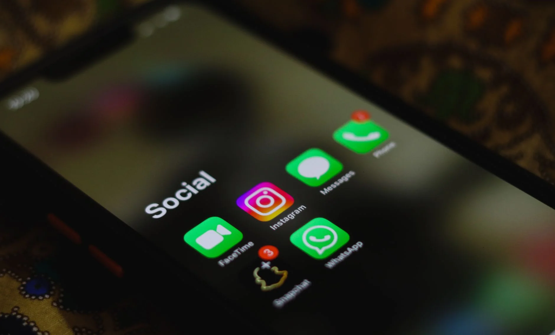 Close-up of a smartphone home screen showing app icons in a grid