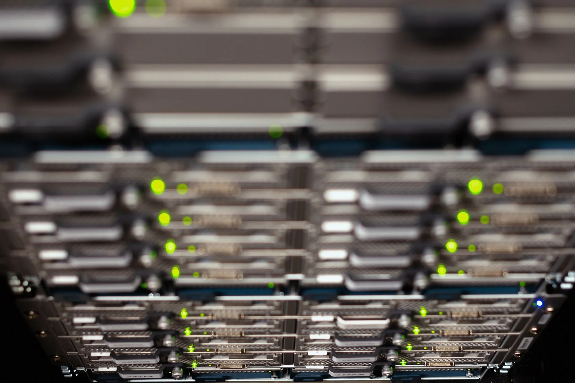Organized server rack with cables routed through cable management arms