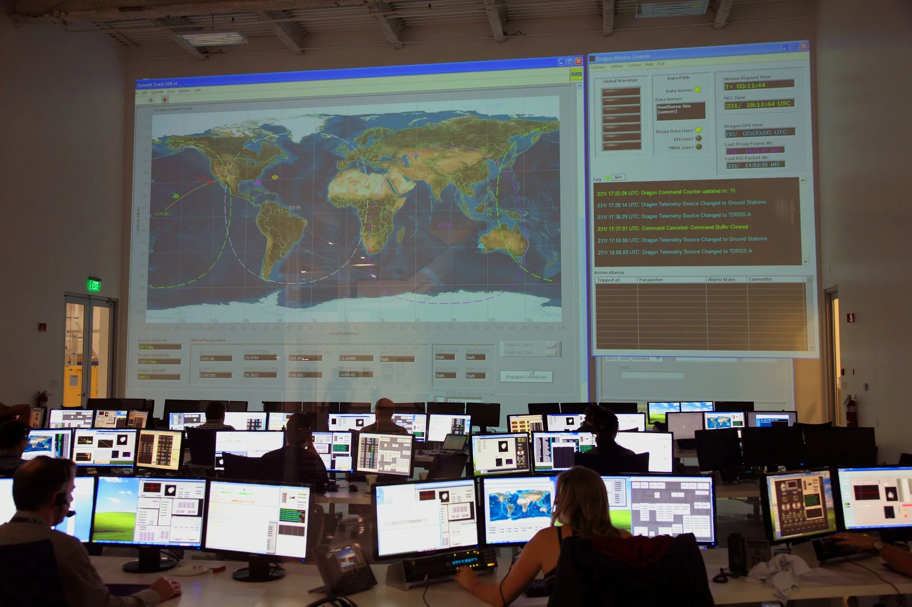 Network operations center with live monitoring dashboards displayed across multiple screens