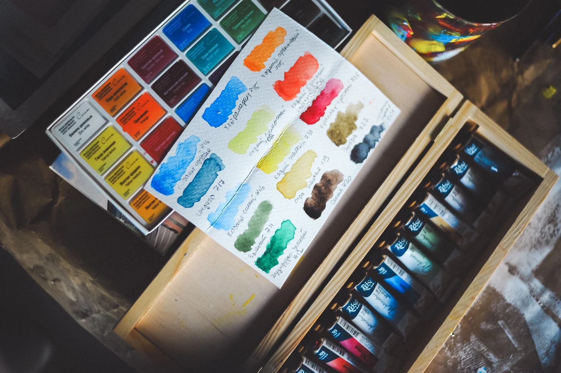 Rows of color swatches and paint chips arranged by hue and value