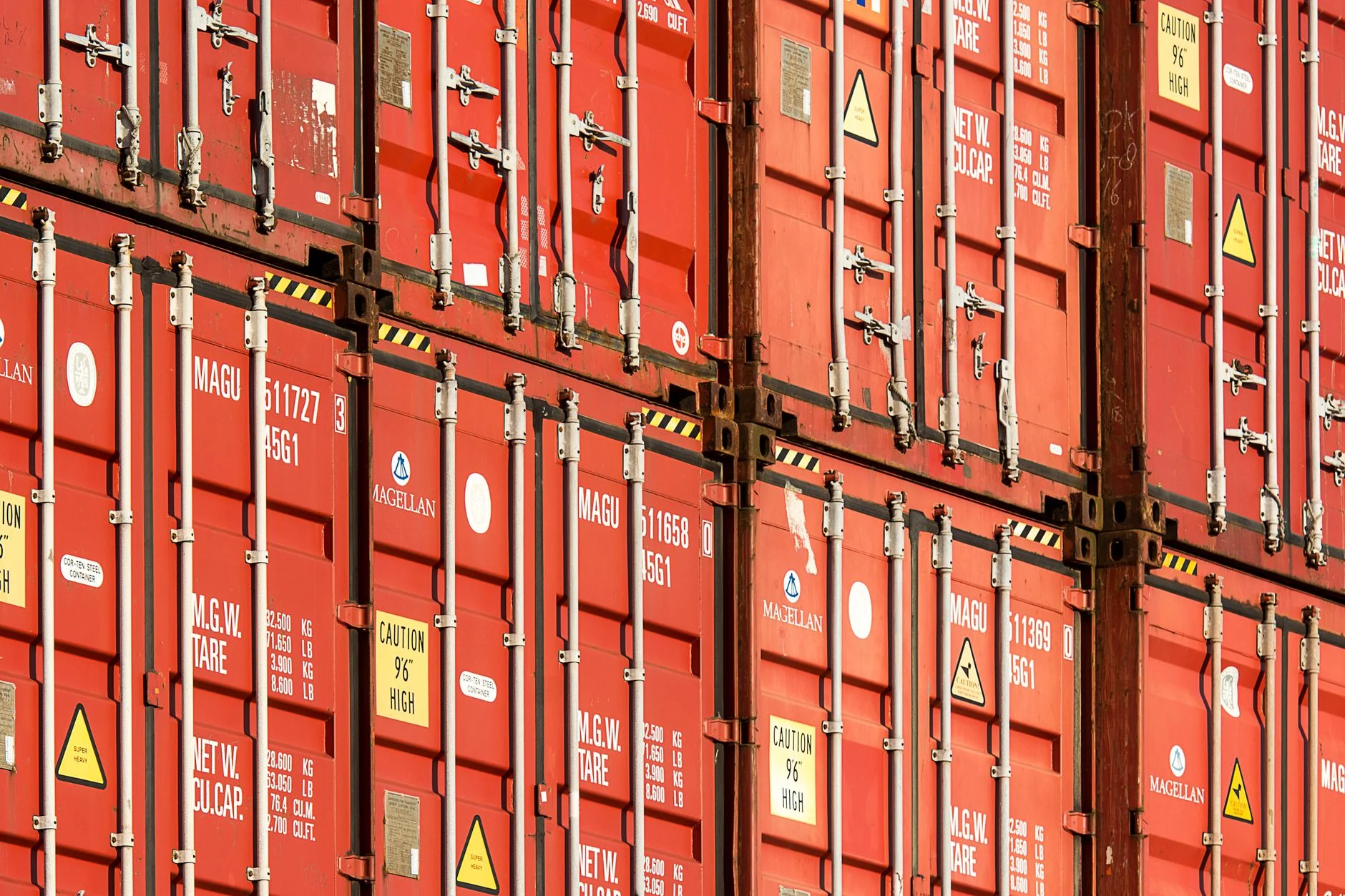 Aerial view of stacked shipping containers in a cargo yard