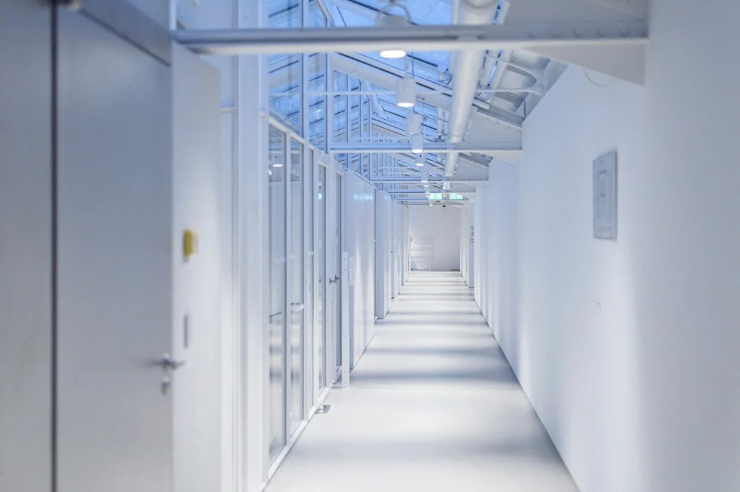 A hallway of server racks representing the backend systems behind an optimistic UI update