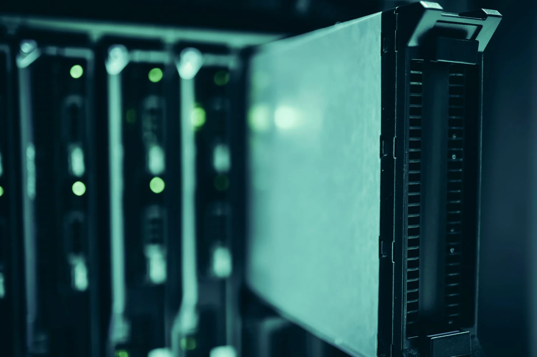 A long hallway of server racks in a data center, representing the infrastructure behind cross-system data integrations
